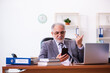 © Elnur - Old male businessman employee working in the office