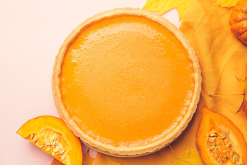 Tasty pumpkin pie on color background