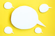 Some white paper speech bubbles concept. Cartoon speech with clipping path on bright yellow background with contrasting shadow