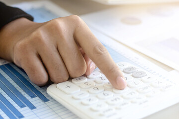 Close up The accountant's hand is using a calculator.