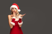 Surprised Cheerful Blonde Young Woman Wearing Santa Claus Costume