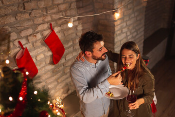 Canvas Print - Couple eating and drinking at New Year's Eve party