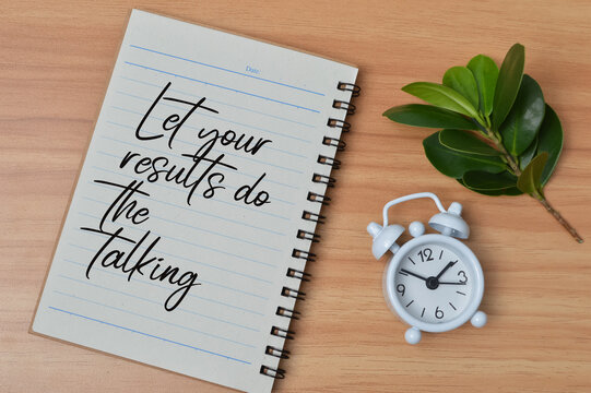 Top view of green leaves, clock and notebook written with text LET YOUR RESULTS DO THE TALKING. Business and education concept.
