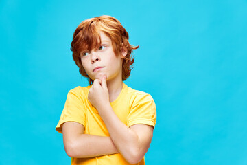 Sticker - red-haired boy pensive look hand on chin yellow t-shirt look