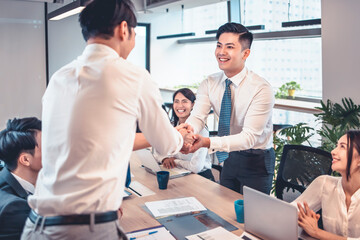 Wall Mural - happy Business people shaking hands in conference room