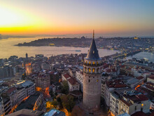 Aerial Galata Tower At Sunset. 
Galata Bridge And Golden Horn Of Istanbul With Beautiful Colors At Sunset. 