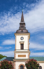 Poster - Beautiful church in Hjo a Swedish city at a blue summer sky