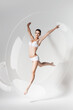 © Artem Popov - beautiful jumping woman in soap bubble