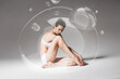 © Artem Popov - sensual sporty woman resting in bubble