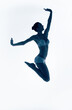 © Artem Popov - silhouette of blue jumping sporty woman