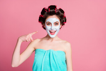 Poster - Close-up portrait of attractive cheerful housewife wear natural clay mask demonstrating smoothing clear skin detox isolated on pink color background