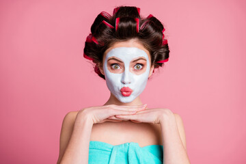 Wall Mural - Close-up portrait of pretty funky childish housewife wearing natural organic mask lifting pout lips isolated over pink color background