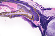Fluid Art. Golden bubble waves in abstract drips of lilac paint. Marble effect background or texture