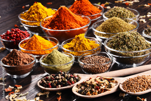 Papel de parede Variety of spices and herbs on kitchen table