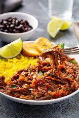 Wall Mural - Ropa vieja, traditional flank steak dish with rice, cuban beans and plantains