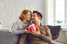 Happy Young Man Holding Valentine Gift, Smiling And Thanking His Girlfriend For Present