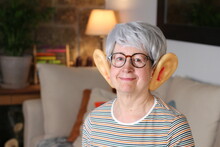 Senior woman with large ears