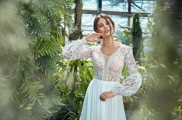 Sexy beautiful woman pretty bride wedding big day marriage ceremony in summer garden wearing long silk and lace white dress bright makeup hairstyle pure love.