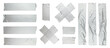 Set of different size silver grey adhesive tape on white background. Torn and crumpled pieces of grey sticky duct tape.