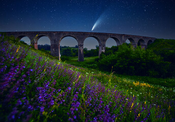 Wall Mural - fantastic starry sky over the old viaduct. long exposure shot, astrophotography.