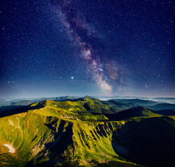 Wall Mural - incredible view of starry sky over summits. location place of carpathian mountains, ukraine.