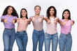 © Prostock-studio - Five Happy Mixed Women Gesturing Thumbs Up Over White Background