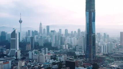 Wall Mural - Establishing aerial cinematic drone b-roll shot of sunrise at Kuala Lumpur city skyline