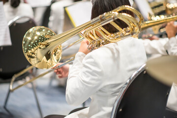 Trombone player with team orchestra performance