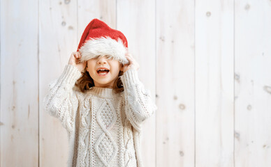 Wall Mural - little girl with Santa's hat