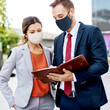© Rawpixel.com - Business people in face mask working in new normal
