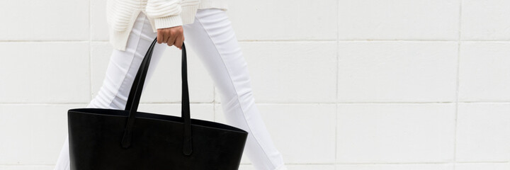 Wall Mural - woman holding a black tote bag mockup website banner template