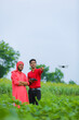 © PRASANNAPIX - Indian farmer and agronomist using drone at agriculture field