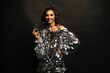© opolja - Beautiful sexy woman wearing sparkle dress with glass of champagne on black background.