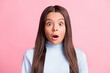 Photo of surprise amazed young school girl looking camera open mouth isolated on pastel pink color background