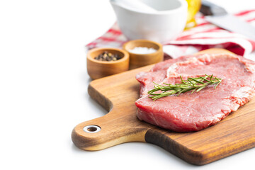 Canvas Print - Sliced raw ribeye steak on cutting board