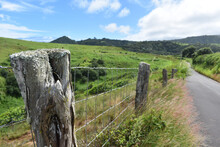 Fencepost From A Green Hilly Ranch Along The Road To Hana On The Island Of Maui, Hawaii