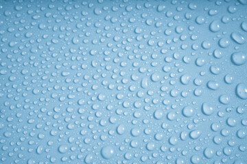 Wall Mural - water drops on blue background