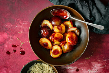 Wall Mural - Roasted plums with brown sugar top view
