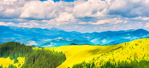 Wall Mural - Green sunny valley in mountains and hills. Nature landscape panorama