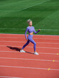 © be free - sexy fitness woman in sportswear. athletic lady warming up on stadium running track. female athlete do sport workout. trainer or coach training. perfect body shape. healthy and sporty