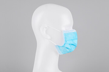 Wall Mural - Blue surgical face mask on a mannequin