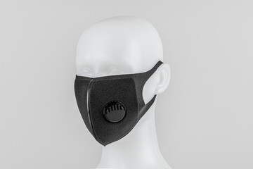 Wall Mural - Black foam mask with valve on white mannequin head