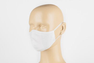 Wall Mural - White fabric face mask on a mannequin