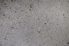 Ground Concrete Floor Inside Building With Polished Gravels.