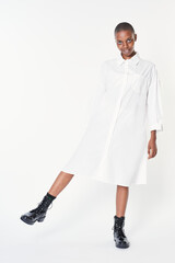 Poster - Black woman wearing black ankle boots in a white dress mockup