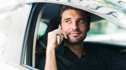 Poster - Man making a call in his car