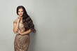© millaf (Nemchinova) - Fashion model woman with long curly hair wearing fashionable evening gown on white background
