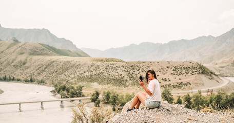 Sticker - woman with smart phone in the mountains