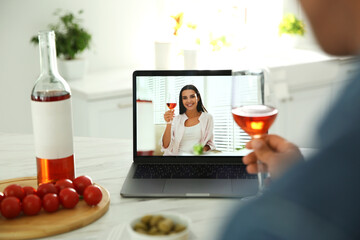 Poster - Friends drinking wine while communicating through online video conference in kitchen. Social distancing during coronavirus pandemic