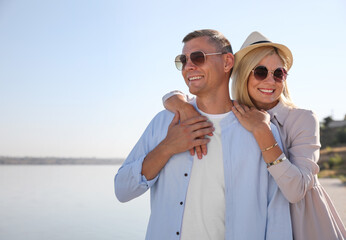 Wall Mural - Happy couple walking outdoors on summer day